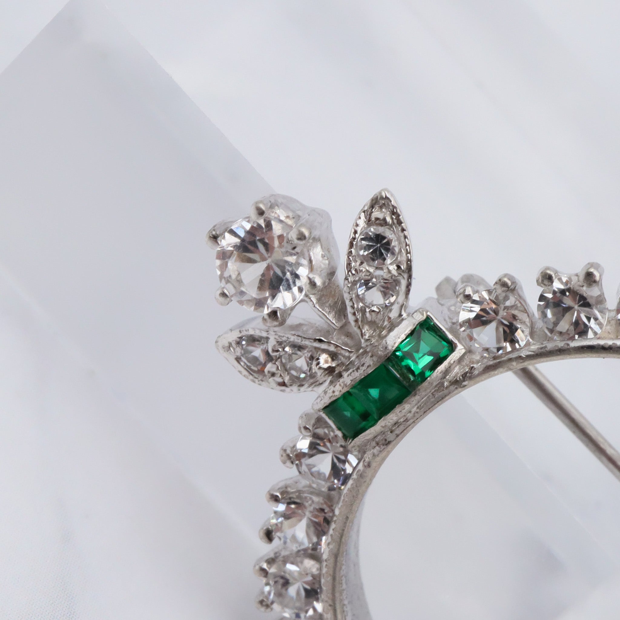 Antique Art Deco rhodium plated sterling, quartz & synthetic emerald circle frame brooch